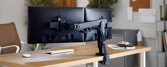 Dual Ollin monitor arm on an office desk